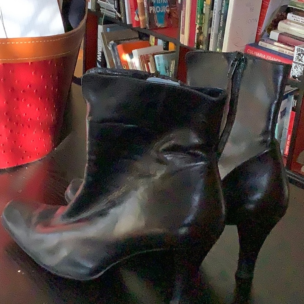 Black leather booties; 3" heel.